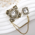 Detail of vintage gold brooch with sparkling crystals, pearls and double hanging chains - TL004-White-Vintage