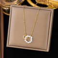 Elegant gold titanium steel necklace featuring interlocking pearl and rope textured rings - Artificial Pearl Double Hoop Necklace (H6052) / Gold