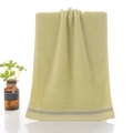Light yellow-green cotton towel with soft looped texture and grey stripe detail - Youth Green