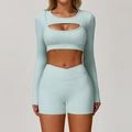 Light blue yoga set featuring a cutout long sleeve crop top and cross waist shorts - S / Top And Bottom / Long Sleeve + Shorts / Cream Green