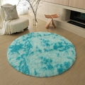 Round shaggy plush rug with blue and cyan tie-dye gradient on wooden floor - Tie-dye Water Cyan