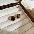 Macro view of vintage oval tiger eye stone earrings with textured gold metal frame - Oval Stud Earrings Style (Silver Pin - Coffee)