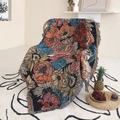 Bohemian floral woven picnic blanket with colorful tassels draped on an indoor chair - Vintage Floral Sunflower / 130x160cm