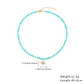 Detail view of turquoise bead necklace with evil eye pendant dimensions and weight info - Aquamarine Evil Eye Necklace