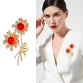 Golden rose brooch featuring red crystal stones and rhinestones on a white blazer - XD823074 Red Double Flower Bow