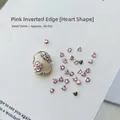 Macro shot of 50pcs pink heart-shaped nail rhinestones with 3x3mm precision cutting detail - Pink Heart 3x3 (XY-1009)