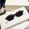 Chic black rectangular sunglasses with slim silver metal temples on white display - Silver Frame Grey Lenses