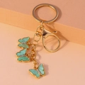 Golden butterfly keychain with three mint green marbled pendants and sparkling rhinestones - Light Green