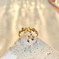 Close-up of a butterfly and flower gold ring on a white stone with natural shadows - Adjustable Open / Gold Pink Zirconia