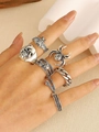 Set of 7 silver gothic rings featuring skull, bat, spider and snake designs on a hand - Gothic Skull Bat Silver Stackable Ring Set (A-293)