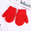 Close-up of warm red coral fleece mittens for kids with soft plush texture - S / Red
