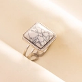 Macro shot of silver ring with square white marble stone on beige silk fabric - Silver/White Marble