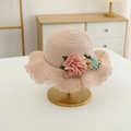 Detail of a pink woven straw sun hat for girls with large fabric flowers and wavy brim - Hat Only / Pink Hat