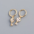 Golden S925 silver hoop earrings featuring clover key charms with sparkling crystals - Gold Color (Pair)