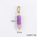 Detail of a natural purple stone bead pendant with dimensions 1.8cm by 0.5cm and gold ring - Purple