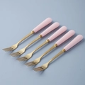 Pink ceramic handle fruit forks with gold stainless steel heads in a diagonal row - Pink - Fruit Fork