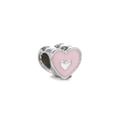 Close-up of heart-shaped silver charm with pink enamel and a small raised silver heart - White K Pink