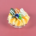 Artificial blueberry cake model with cream and fruit on a paper base for photography - Walnut Blueberry