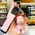 Pink bear keychain with leather wristlet embossed with Advance Bravely text and black ring - Pink