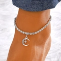 Silver rhinestone tennis anklet with crescent moon pendant worn on an ankle - Star Moon Pendant Style (11708) / Silver