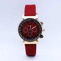 Close-up of red quartz watch with gold case and decorative chronograph sub-dials - Bright Gold with Bright Red Strap