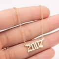 Macro shot of gold stainless steel necklace with 2007 gothic year number pendant for women - 2007 / Gold
