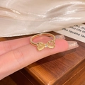 Golden butterfly ring with yellow opal stones and zircon worn on fingertips - Gold - Bowknot Yellow Cat Eye