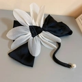 Detail of elegant black fabric bow hair clip with white flower and pearl drop pendant - White Black Petal Bow Spring Clip (134#)