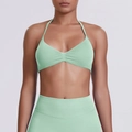 Detail of mint green seamless halter sports bra and high-waisted leggings set for yoga - Palm Green