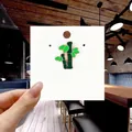 Detail of bamboo shaped green enamel brooch with gold alloy edges on white display card - 127*Green Bamboo Branch Pin