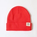 Red knit beanie for babies with a cute smiley face patch and feelingbaby label - One Size / Red