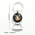Detail view of butterfly bottle opener keychain with letter K showing dimensions 8.3x3cm - Letter K