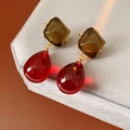 Detailed shot of vintage amber and red resin drop earrings on a grey velvet display - Silver Pin-Gold-Green-Red (Earrings)