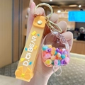 Cute orange popsicle acrylic keychain with colorful beads and rubber wrist strap - Lanyard Style / Iridescent