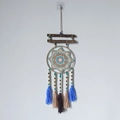 Boho Evil Eye dream catcher with blue tassels and wooden beads hanging on a wall - 9545K With Wood Stick