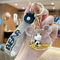 Panda liquid quicksand keychain featuring floating glitter and grey BEAR silicone strap - Bear