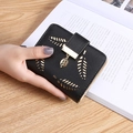Women's short black leather wallet featuring leaf buckle and gold pendant detail - Black