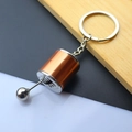 Detailed macro view of the brushed bronze and silver 6-speed manual gear shifter keychain - Gear Shift Knob / Gold