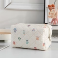 Quilted makeup bag with colorful cartoon animal prints and secure zipper closure - Cartoon Character