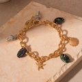 Gold chain bracelet with starfish and seashell charms featuring a toggle clasp design - Gold Conch Shell Starfish T Buckle Bracelet