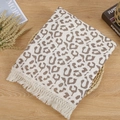 Macro detail of leopard print cotton muslin baby blanket with delicate fringe edges - Leopard Print