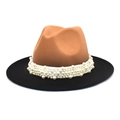 Detail of two-tone brown and black fedora hat with white faux pearl decorative band - Camel + Black