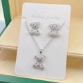 Detailed view of silver bear jewelry set with necklace and earrings in a green gift box - Silver Bear Set (L)