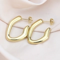 Modern U-shaped gold titanium steel hoop earrings on elegant pink satin background - Smooth Irregular / Gold