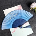 Handmade bamboo folding fan with blue gradient cherry blossom pattern and blue tassel - Cherry Blossoms Falling - Blue Handle