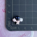 Detailed macro view showing a 2x2cm skull balloon resin charm for DIY phone case crafts - Skull Heart Rabbit Balloon