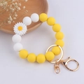 Detail of silicone beaded wristlet keychain with white daisy charm and gold hardware - White Daisy