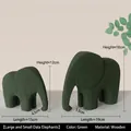 Modern set of two matte green wooden elephant statues in small and large sizes - Elephant Green Pair