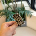 Detailed close-up of marble pattern hair claw clip with Barrette La France lettering - Star Leopard Print