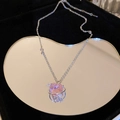 Detailed view of pink heart zircon necklace on heart mirror inside jewelry box - Pink Heart with Halo